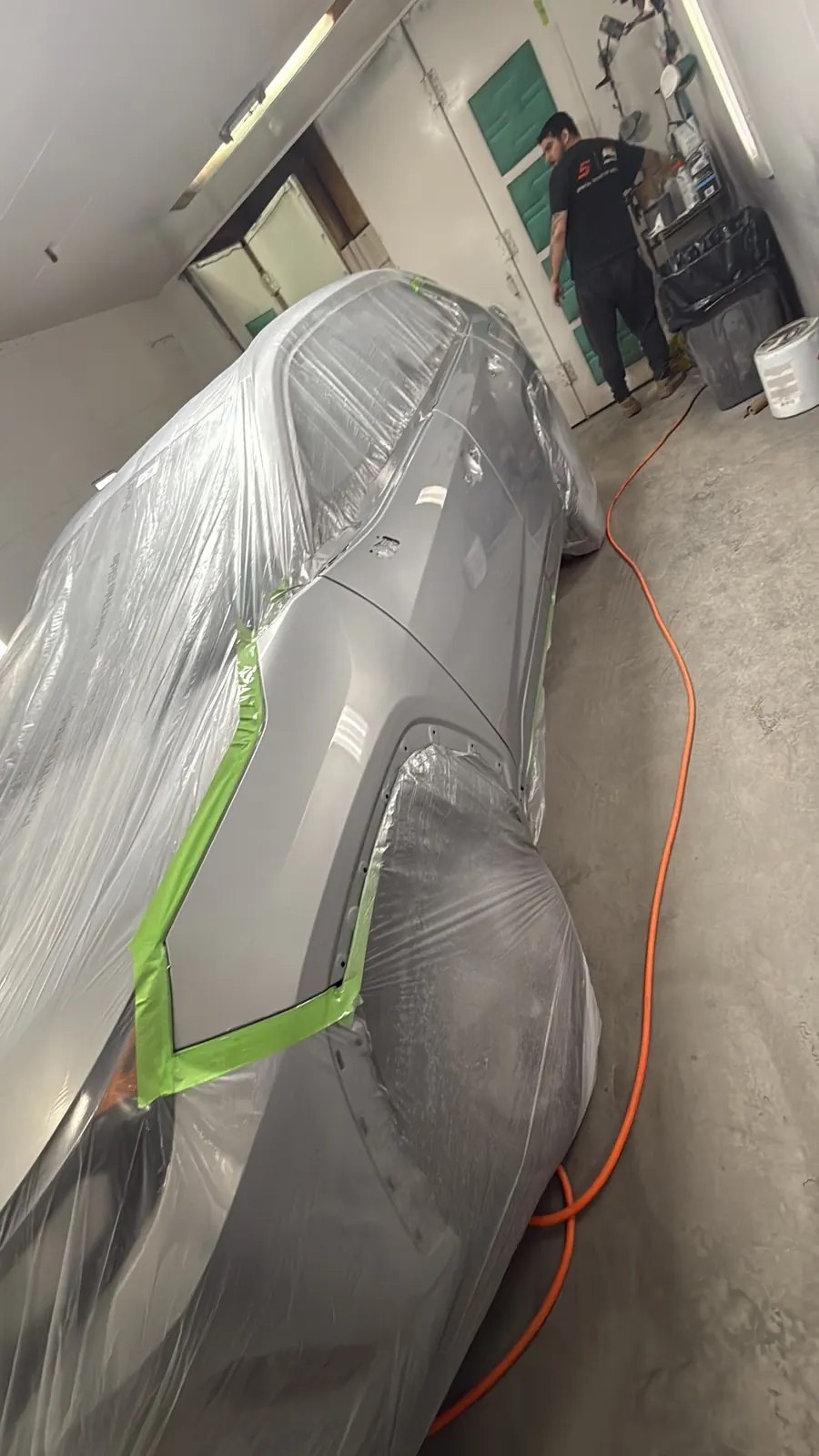 Vehicle masked and prepped inside the paint booth